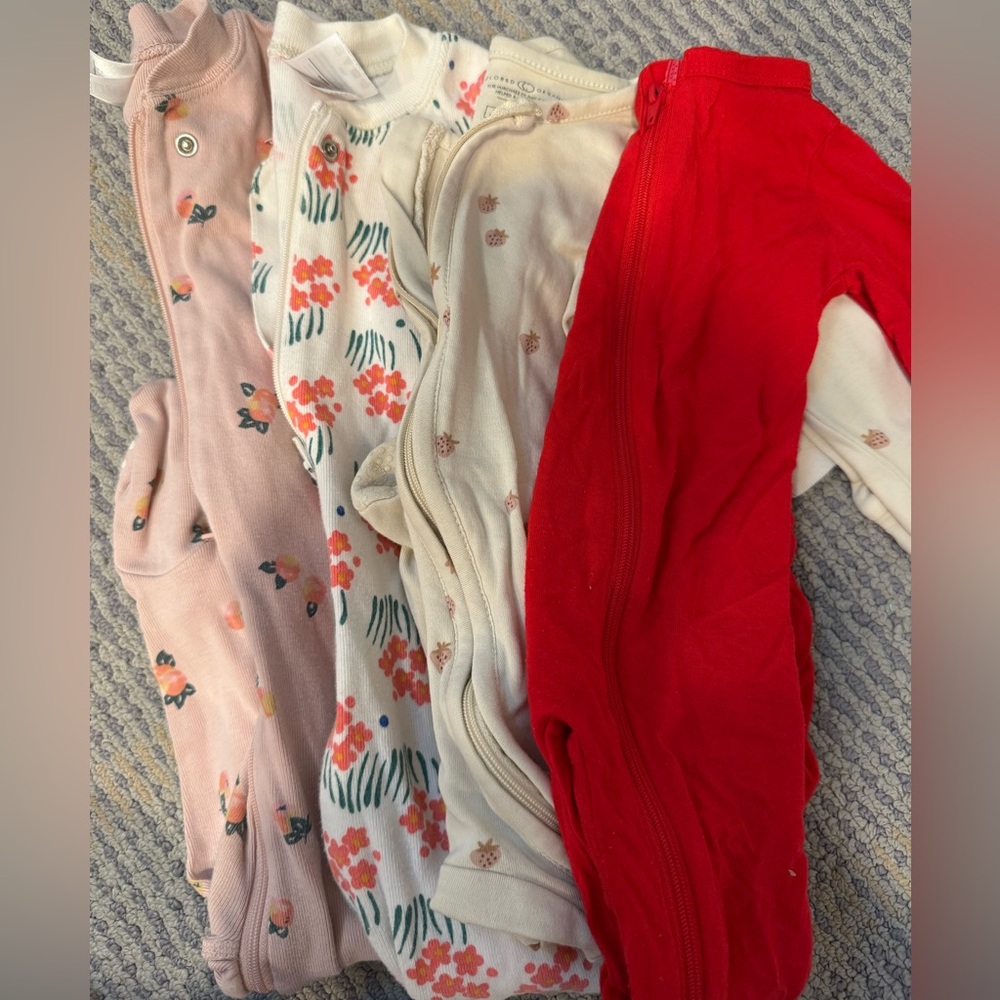 Set of Baby Onesies in Pink, Cream, and Red